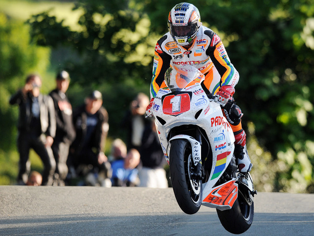 John McGuinness on his way to his 19th win at the Isle of Man TT, and his first victory in the Superstock class